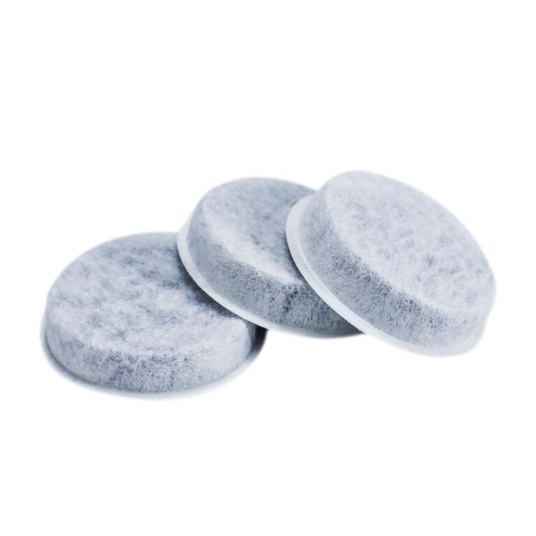 Three round, gray water filter replacements with white rims