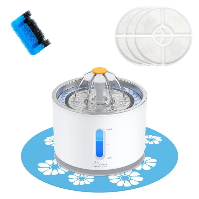 Pet water fountain with filters and cleaning sponge on a blue mat