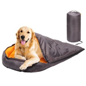 Golden retriever dog in a gray and orange sleeping bag