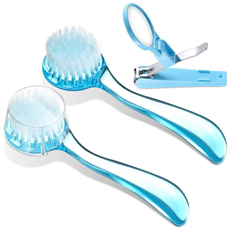 Blue baby nail clippers, two brushes, and a magnifying glass