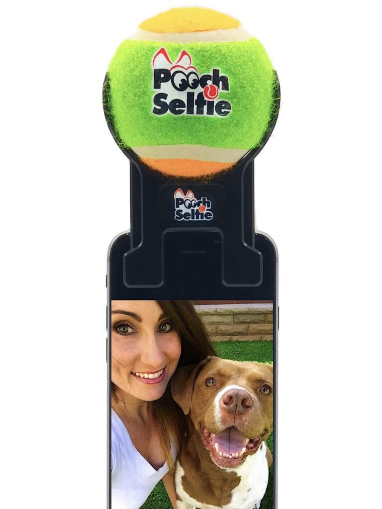 Woman and dog taking a selfie with a "Pooch Selfie" tennis ball holder