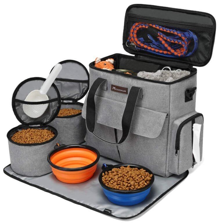 Dog travel bag with food containers, bowls, leash, and toys